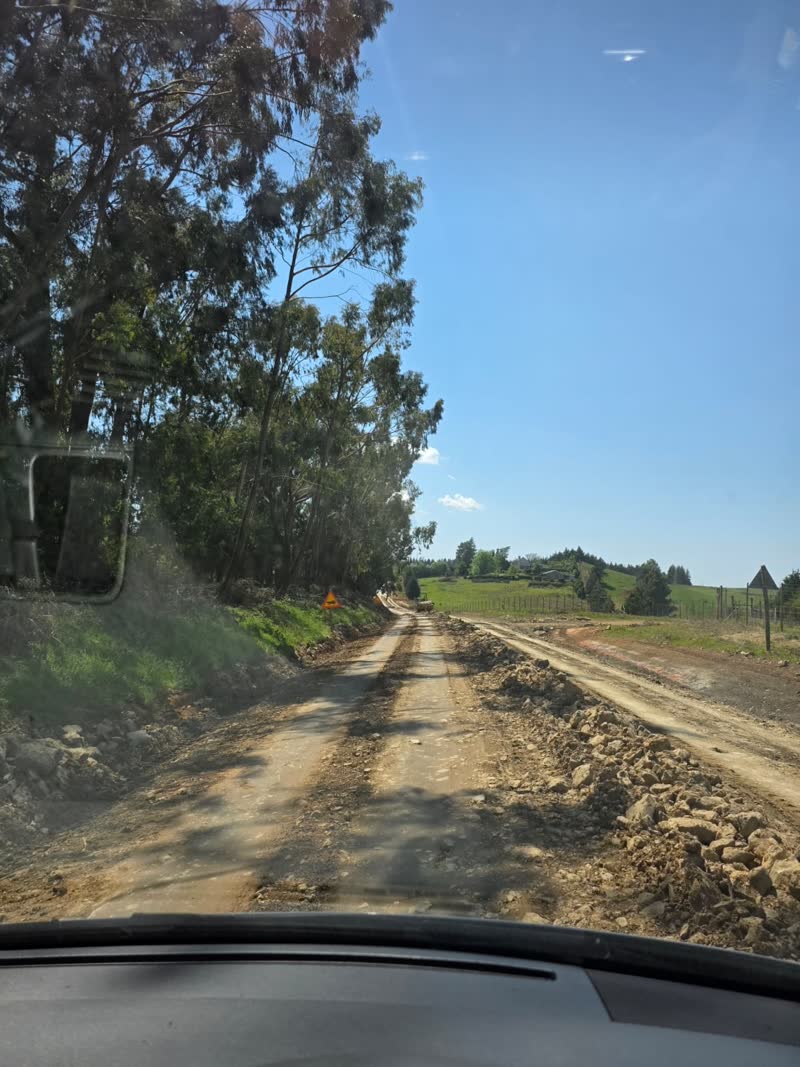 Scenic farm dirt road in Nottingham Road area, representing free travel coverage within 100km from Hillcrest for wedding DJ services