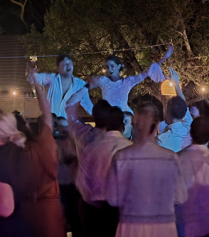 Jade and Blake lifted up above a packed dance floor at their Bonamanzi wedding