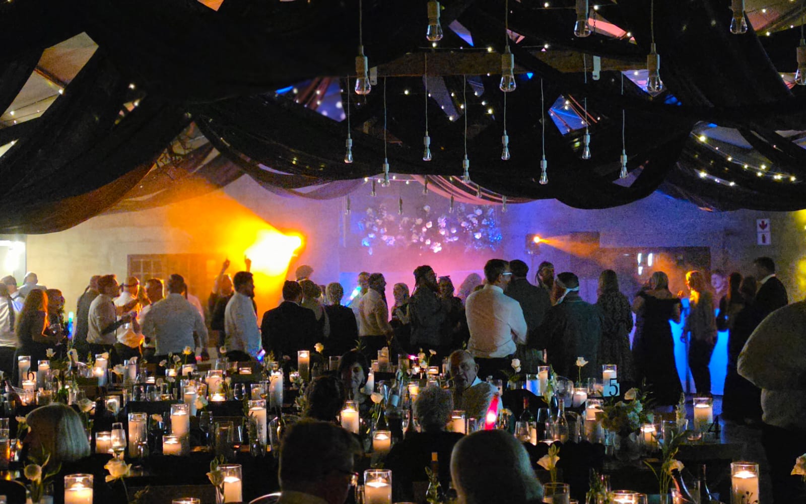 Haycroft Farm reception hall with candles and colorful uplighting in Dargle Valley KZN Midlands