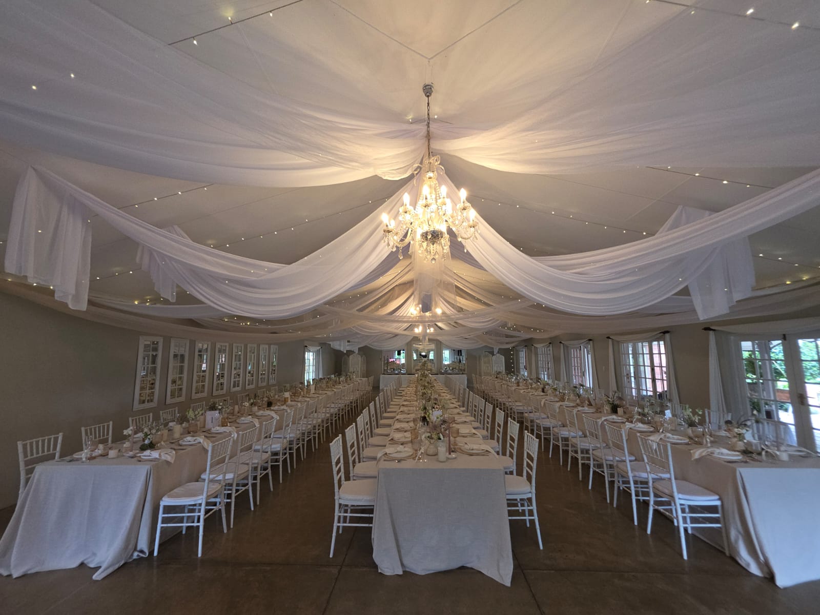 Providence Country Weddings reception room with elegant long banquet tables setup for wedding dinner in KZN Midlands venue