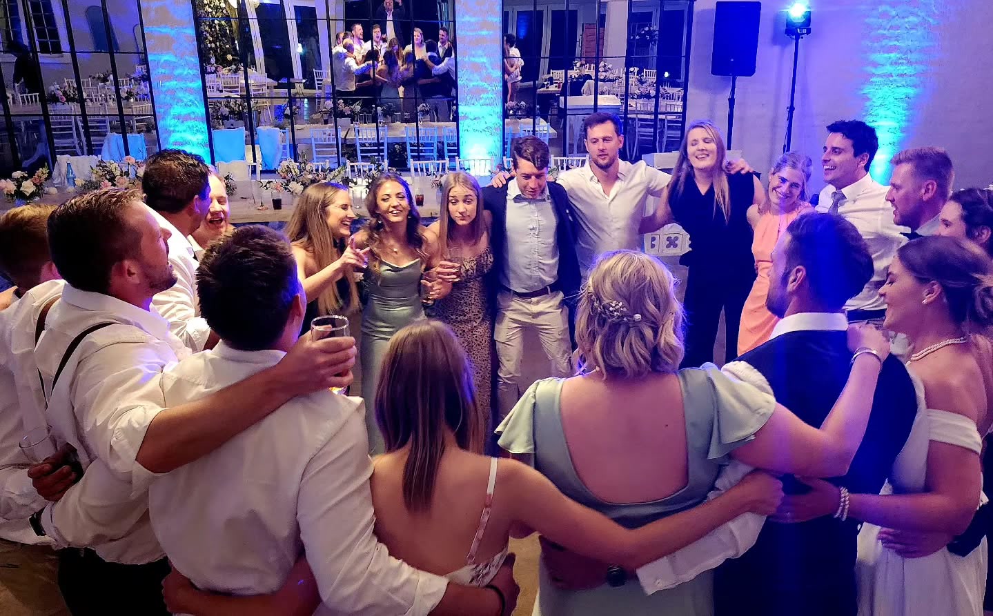 The Groves wedding dance floor with guests dancing and professional DJ lighting at Nottingham Road venue