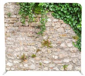 Stone wall photo booth backdrop with ivy for indoor wedding receptions in KZN Midlands